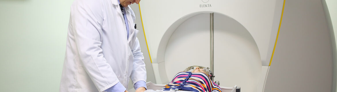 gamma knife radiosurgery - physician prepares patient for the procedure on the Gamma Knife