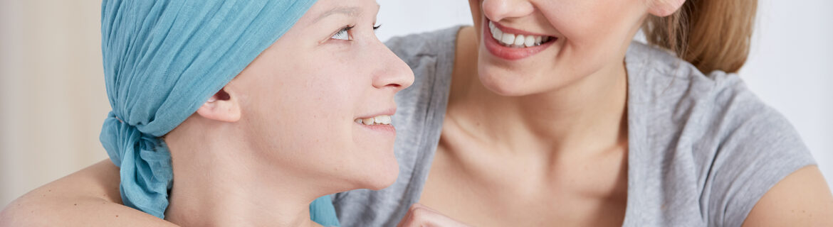 radiotherapy treatment - cancer woman wearing headscarf talking with friend